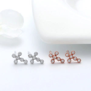 Detailed view of S925 silver cross stud earrings in silver and rose gold with 4A zircon