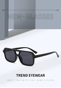 Detail of trendy black double-bridge square sunglasses with vintage oversized frames
