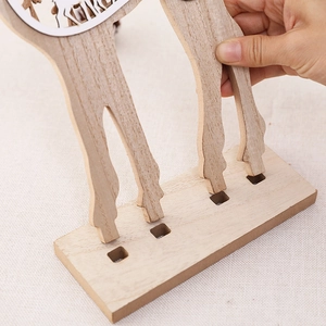 Creative wooden hollow reindeer ornament with DIY plug-in assembly structure and wood grain