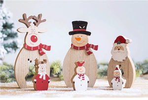 Detail of Nordic wooden Christmas table ornaments with reindeer, snowman and Santa