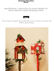 Detail of wooden red Christmas mailbox with LED lights, snow accents, and pine needles