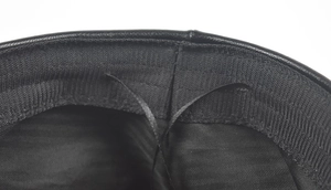 Detail view of the black leather beret with inner lining and adjustable drawstring cord
