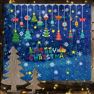 Christmas window decals with colorful trees and Merry Christmas text on a glass pane