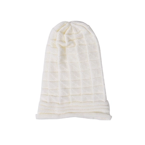 Close-up of white waffle knit texture and rolled edge on this winter beanie hat