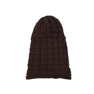 Detailed view of dark coffee knitted beanie with textured checkered pattern and cuff