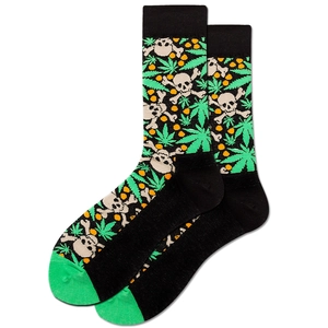 Detailed view of black crew socks with skull, green leaf, and orange polka dot patterns
