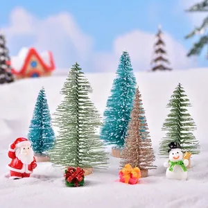 Miniature Christmas landscape set with artificial trees, snowmen and Santa figurines