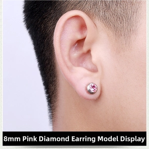 Detailed view of 8mm pink stone magnetic stud earring on earlobe with silver finish