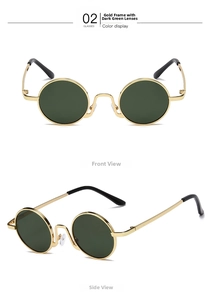 Detail view of round vintage sunglasses with gold metal frames and dark green lenses
