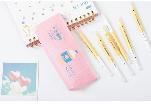 Pink checkered pencil case with cute graphic and double-ended yellow highlighter