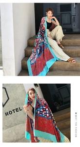 Detail of bohemian style shawl with colorful geometric prints for summer sun protection