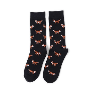 Close-up of black crew socks featuring orange pixelated fox patterns and ribbed cuffs