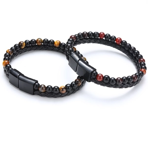 Detail of double-layer men's leather bracelets with tiger eye stones and magnetic clasp