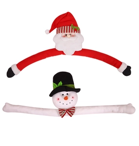 Detail of plush Santa and Snowman tree topper decorations with bendable arms for holiday