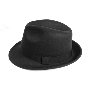 Close-up of classic black wool felt fedora featuring a wide grosgrain ribbon band and brim