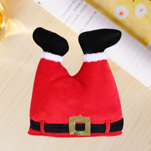Macro shot of creative Christmas elf pants hat with velvet fabric and golden buckle details