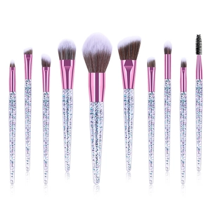 Set of 10 makeup brushes with pink glitter handles and brown-white gradient bristles