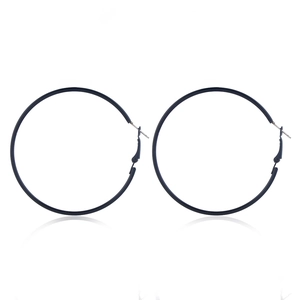 Close-up of deep blue oversized hoop earrings with secure hinged clasp design