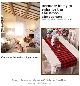 Detail of red and black buffalo plaid Christmas table runner and wine bottle covers