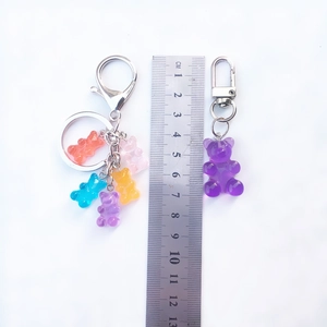 Macro detail of gummy bear keychain showing size scale and vibrant resin colors