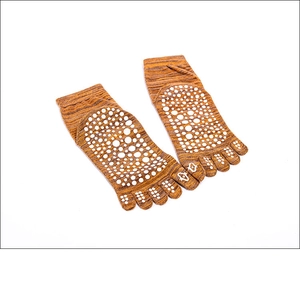 Brown cotton five-finger yoga socks with white anti-slip grip dots on a white background
