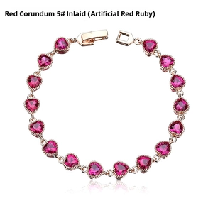Detail view of heart-cut synthetic ruby bracelet set in rose gold plating with a secure clasp