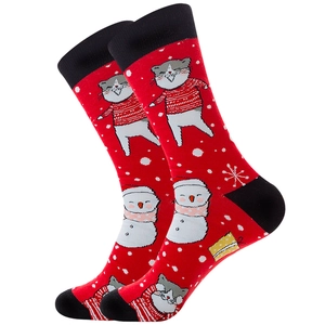 Detail of red Christmas cotton socks featuring a cat, snowman, and holiday snowflake patterns