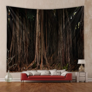 Detail of bohemian forest tapestry with dense banyan tree roots hanging over a red sofa