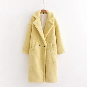 Detailed view of yellow teddy coat featuring wide lapels and double-breasted buttons