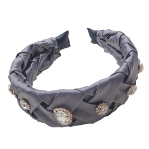 Elegant dark grey satin braided headband with sparkling rhinestones on white background