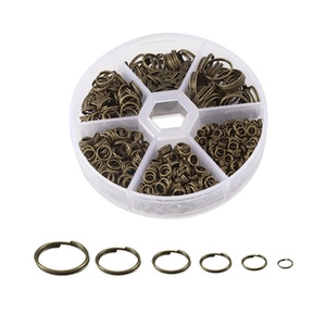 Detailed set of bronze-colored stainless steel jump rings in various sizes with clear storage box