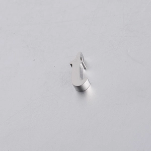 Macro shot of mirror-polished silver stainless steel 10mm alphabet bead featuring letter T