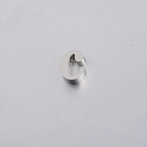 Macro shot of 10mm mirror polished stainless steel letter C charm with a pre-drilled hole