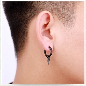 Minimalist black stainless steel hoop earring with punk spike pendant worn by a man