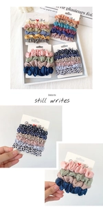 Detail of colorful satin and polka dot hair scrunchies displayed on Sweet Girl cards