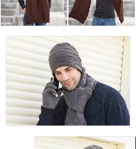 Detailed view of male model wearing grey knitted hat, scarf and gloves set in winter.