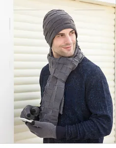 Detailed knit texture of gray winter set including beanie, scarf, and touchscreen gloves