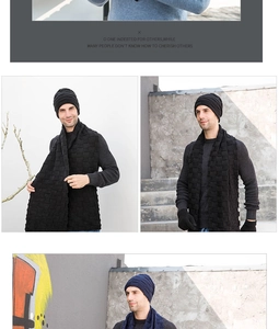 Macro detail view of the premium black and navy blue knitted beanie, scarf, and gloves