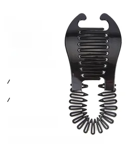 Detail view of the black plastic side comb hair styling tool with wavy teeth