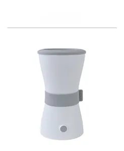 Detail view of electric pet paw cleaner with power button and Kinpet branding
