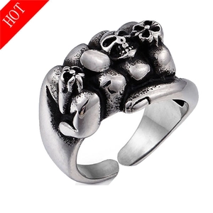 Detailed view of vintage punk skull rings with adjustable open band and antique silver finish