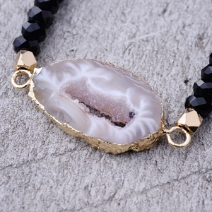 Faceted black crystal beads bracelet with a natural white druzy agate slice in gold frame