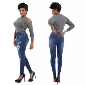 Detail of high waist ripped jeans with leopard print patchwork and skinny fit design