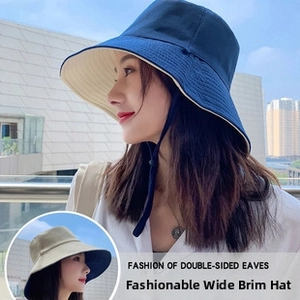 Detail of double-sided cotton bucket hat with adjustable windproof drawstring strap