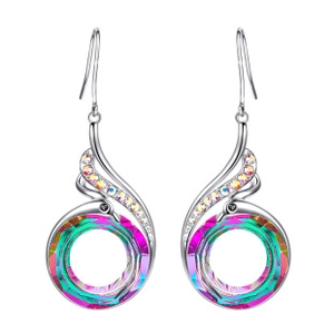 Macro shot of peacock earrings with colorful faux crystals and polished silver metal