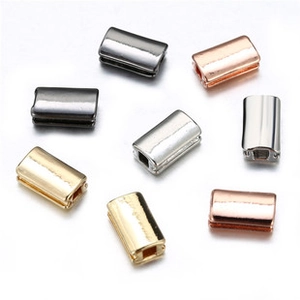 Close-up of polished 18k gold plated rectangular metal end caps for DIY jewelry making
