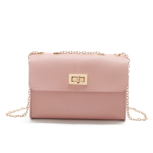 Detailed close-up of pink PU leather bag with golden chain strap and rotary metal lock