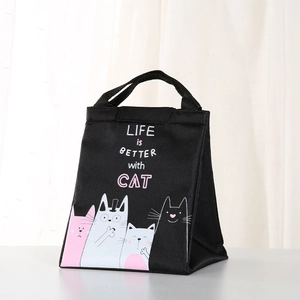 Detail of black canvas lunch bag with cartoon cats and LIFE IS BETTER WITH CAT text