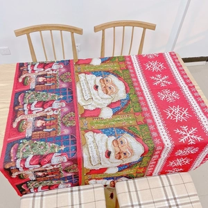 Detailed Christmas table runner with Santa patterns and snowflakes on wooden surface