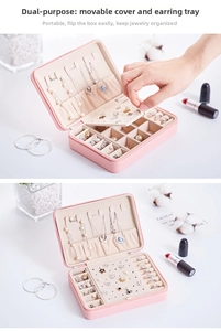 Pink leather jewelry organizer showing necklace hooks and ear stud plate detail